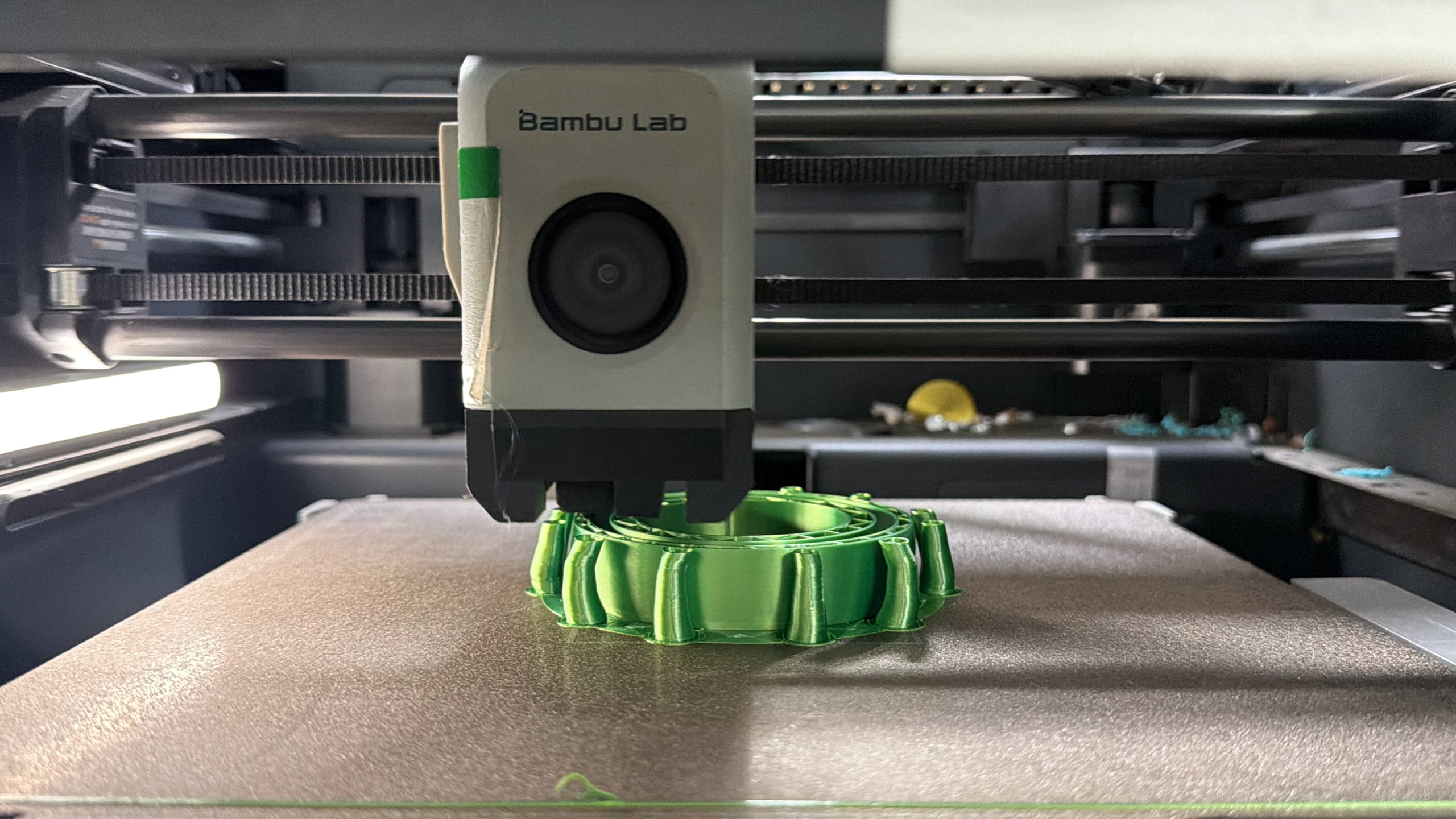 PETG printed test model beside printer and profile notes