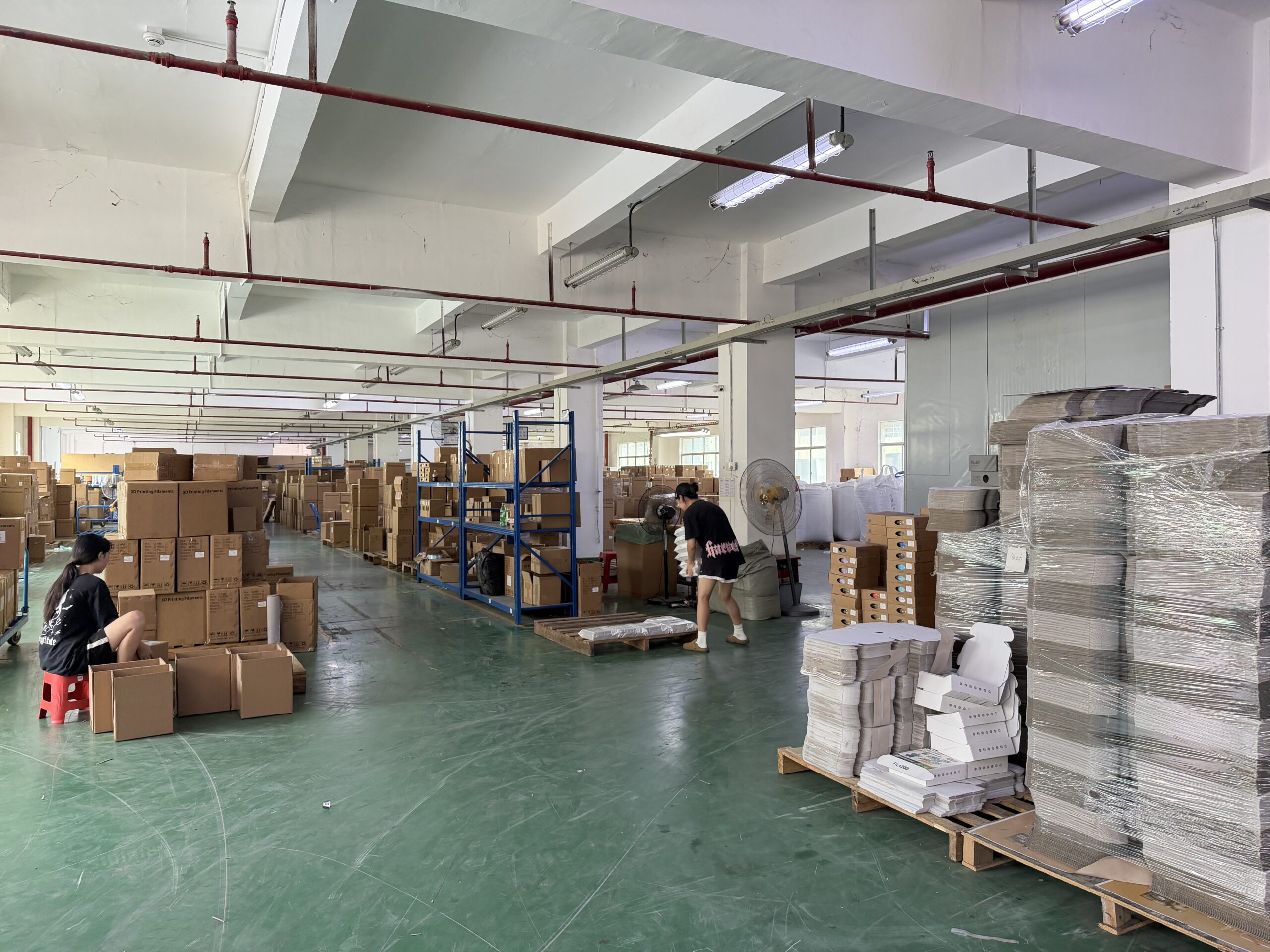 Cartons and palletised materials in a production warehouse