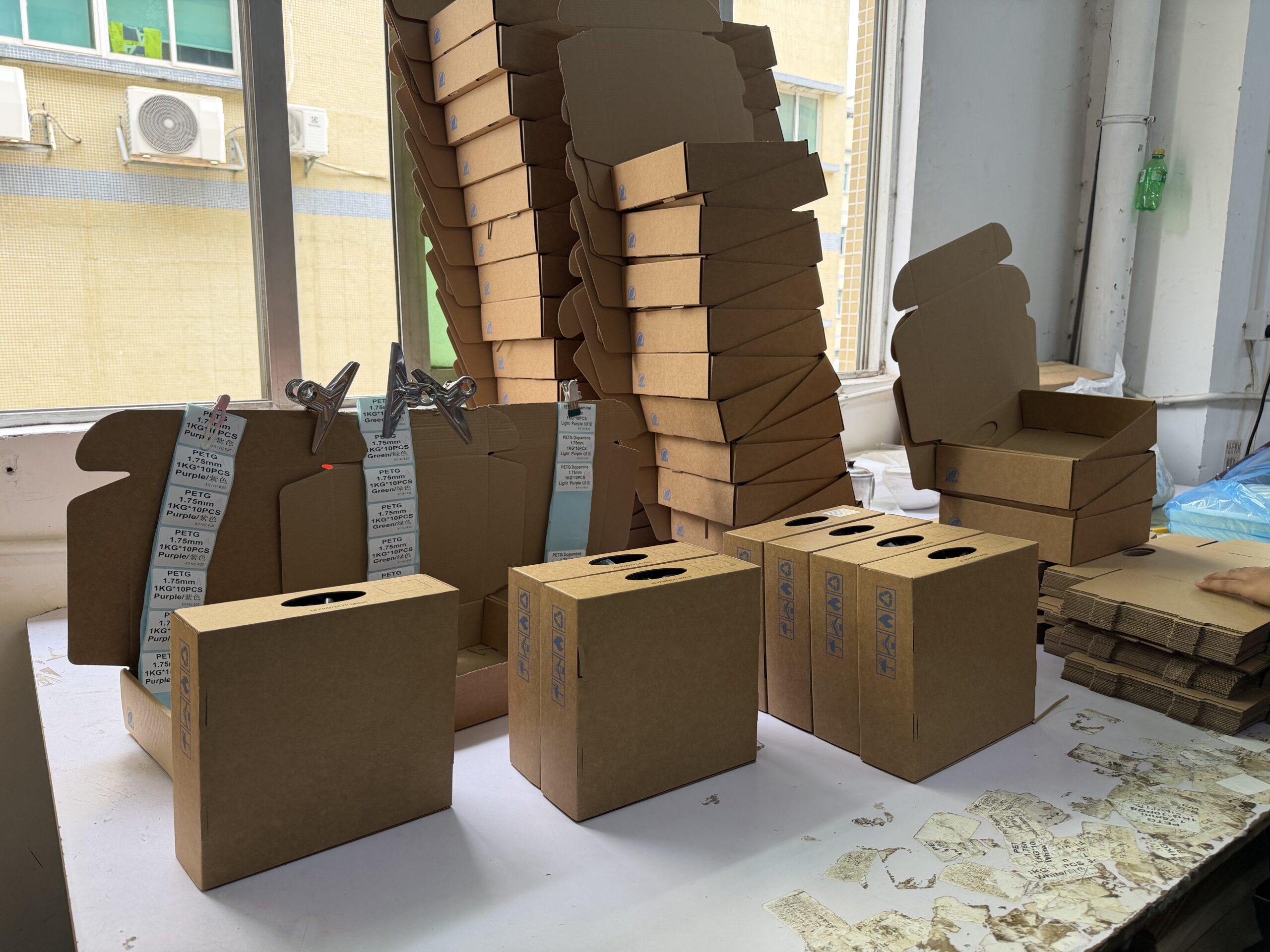 Product cartons and packaged filament prepared for shipment.