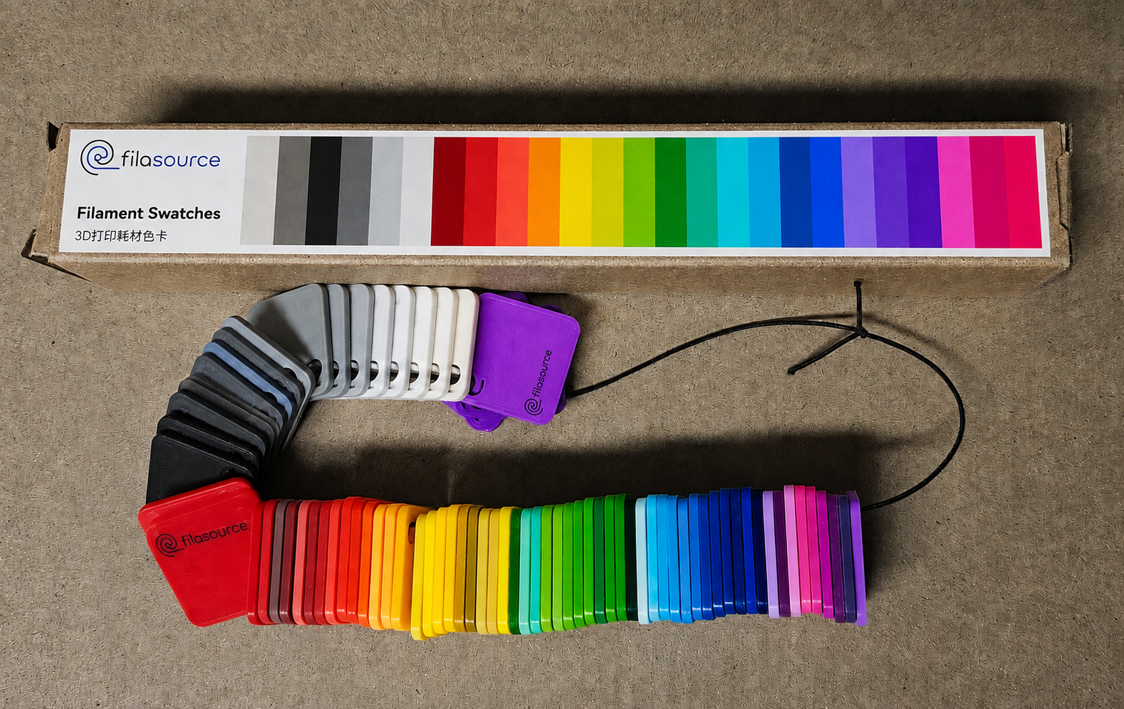 Four filament spools in different colours